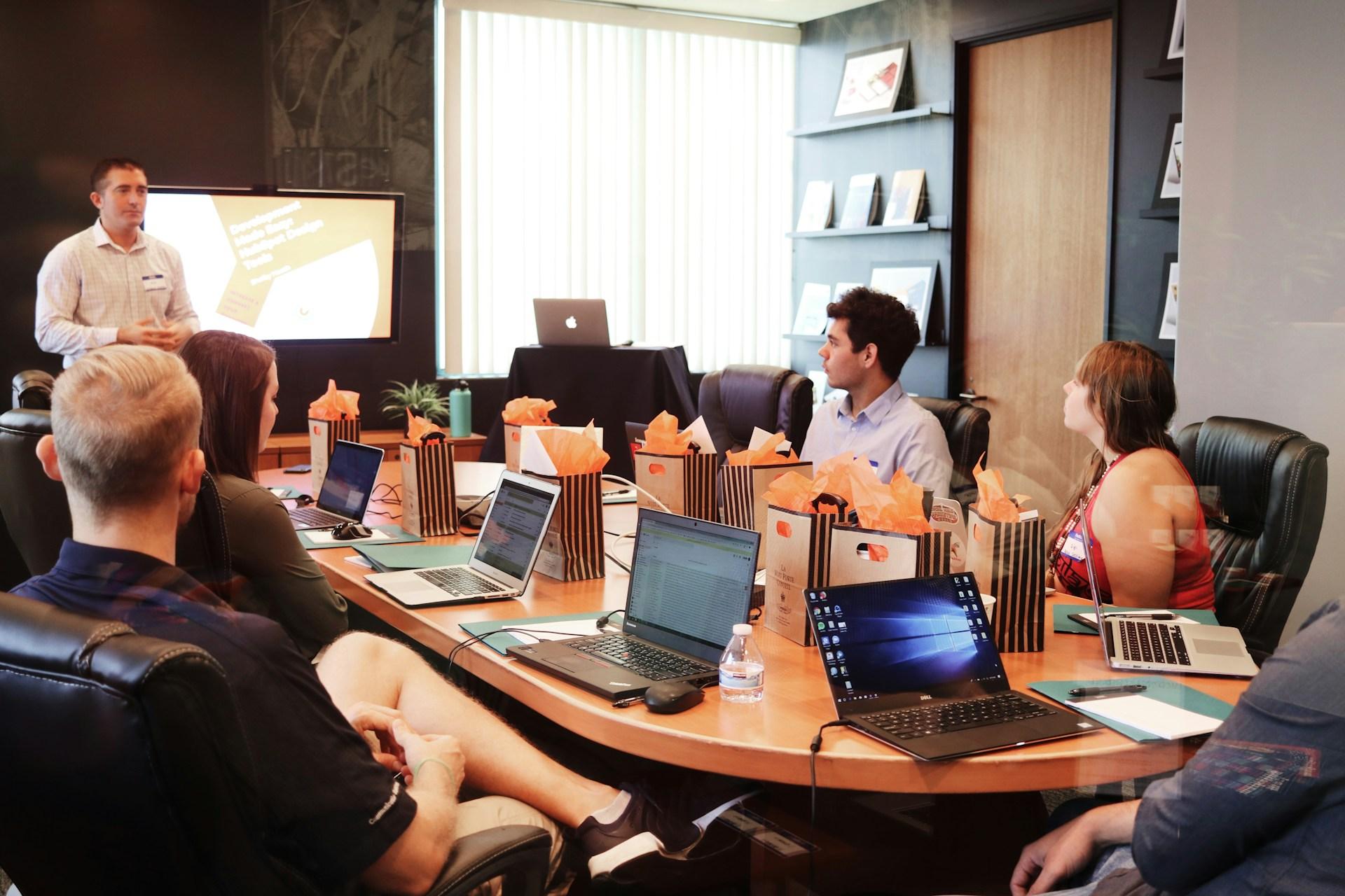Professional office meeting outlining comprehensive local SEO services.